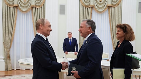 Russian President Vladimir Putin, left, and US President Donald Trump's special envoy Steve Witkoff, right, shake hands during their meeting at the Kremlin in Moscow, Russia, Wednesday, Aug. 6, 2025.