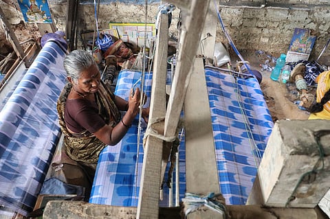 The problem, weavers explain, lies in the nature of their material. Silk and cotton threads easily absorb moisture from the air, which makes them swell and tighten.
