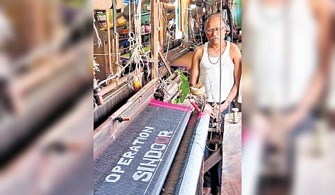 Weaver Tejappa Chinnur works at his loom, making an ‘Operation Sindoor’ saree in Gajendragad, Gadag district.