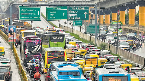 Vehicles move at a snail’s pace during Prime Minister Narendra Modi’s visit to Bengaluru to inaugurate the Yellow Line of the Namma Metro Phase-2 project, on Sunday