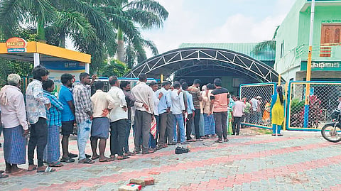 Farmers stand in a queue at Illanthakunta mandal in Rajanna-Sircilla district on Monday to buy urea amid complaints of a shortage