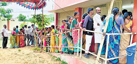 people stand in queue to cast their votes during Vontimitta ZPTC elections