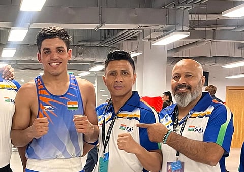 India men's boxing team head coach Dharmendra Singh Yadav (right)