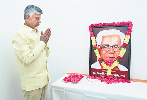 Chief Minister N Chandrababu Naidu pays floral tributes to the portrait of Sardar Gouthu Latchanna on Saturday | EXPRESS