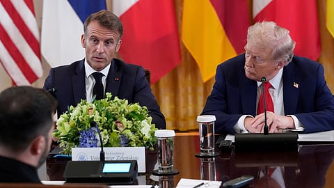 France's President Emmanuel Macron speaks as President Donald Trump, right, listens during a meeting with Ukrainian President Volodymyr Zelenskyy and European leaders in the White House on Monday.