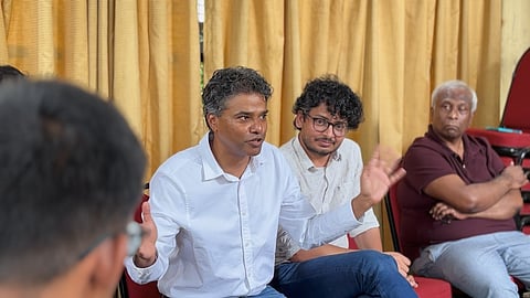 Writer and book collector VR Ferose (left) addresses members of The Book Hunters of Bengaluru community