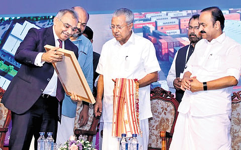 Adani Ports and Special Economic Zone CEO Ashwini Gupta presenting a memento to Chief Minister Pinarayi Vijayan at the groundbreaking ceremony of Adani Logistics Park at Kalamassery, Kochi, on Saturday. Leader of Opposition V D Satheesan and Industries Minister P Rajeeve are also seen