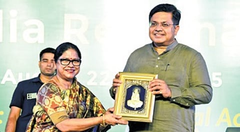 Sahoo presenting a memento to Law Minister Prithiviraj Harichandan.