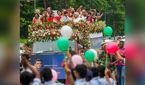 Group Captain Shubhanshu Shukla with his wife Kamna and others during a victory parade as he is welcomed after his historic mission to the International Space Station (ISS), in Lucknow, Monday, Aug. 25, 2025.