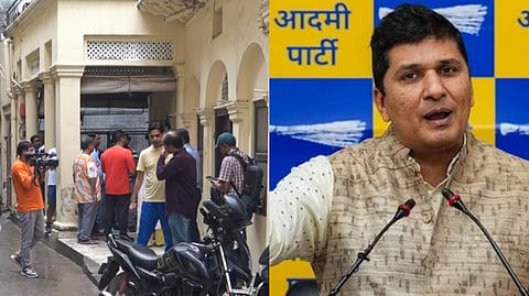 People outside AAP leader Saurabh Bharadwaj's residence amid a raid being conducted against him and others by the Enforcement Directorate as part of a money laundering probe linked to an alleged scam in health infrastructure projects during the previous AAP government in Delhi, in New Delhi.
