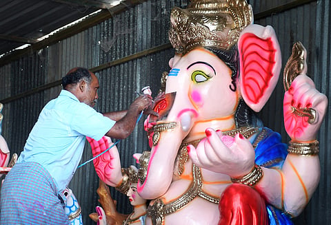 An artist paints an idol ahead of Ganesh Chavithi in Tirupati on Monday