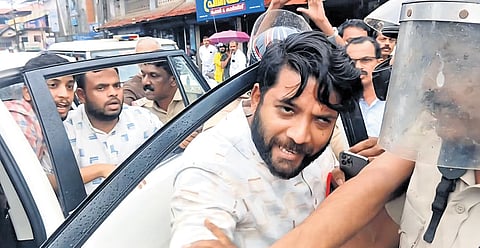An agitated Shafi Parambil, the Vadakara MP, steps out of his car after DYFI activists blocked his vehicle and staged protest in Vadakara town on Wednesday