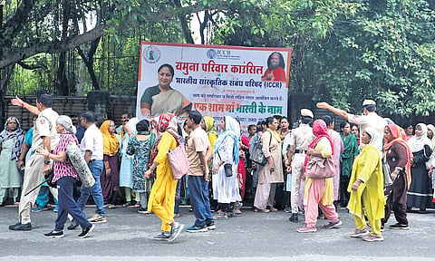 Police personnel managing a crowd outside CM’s residence on Wednesday.