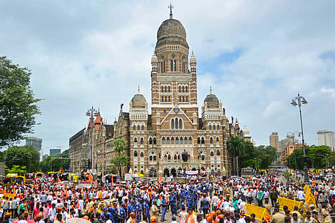 Supporters of activist Manoj Jarange Patil, who is on hunger strike demanding Maratha reservation, gather outside Chhatrapati Shivaji Maharaj Terminus to join his agitation, in Mumbai, Saturday, Aug. 30, 2025.