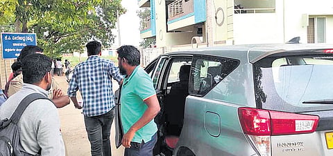 Directorate of Enforcement officials outside the residence of Chitradurga MLA
KC Veerendra at Challakere, Chitradurga district, on Tuesday.