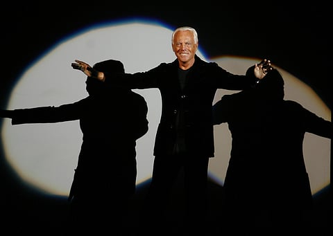Giorgio Armani receives his share of applause after presenting his Emporio Fall-Winter 2007-2008 men's fashion collection, during the Milan Men's Fashion Week, in Milan, Italy, Monday, Jan. 15, 2007.
