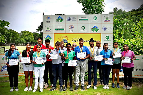 Junior boys and girls with medals at the Cosmopolitan Golf Course on Thursday