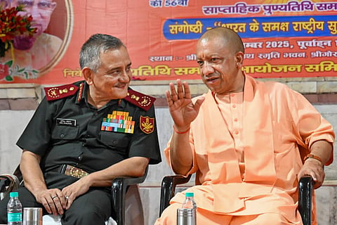 Chief of Defence Staff General Anil Chauhan, left, and Uttar Pradesh Chief Minister Yogi Adityanath during Shrimad Bhagwat Katha seminar and tribute meeting of late Mahant Digvijaynath and the 11th death anniversary of Mahant Avaidyanath, at Gorakhnath Temple.