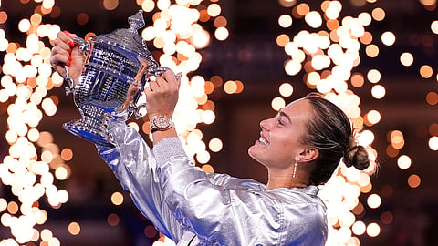 Aryna Sabalenka, of Belarus, holds her trophy aftyer defeating Amanda Anisimova, of the United States, after the women's finals of the U.S. Open tennis championships, Saturday, Sept. 6, 2025, in New York.