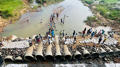 Stone chips, cement bags and sand were arranged to build the diversion from ‘Shram Daan.’