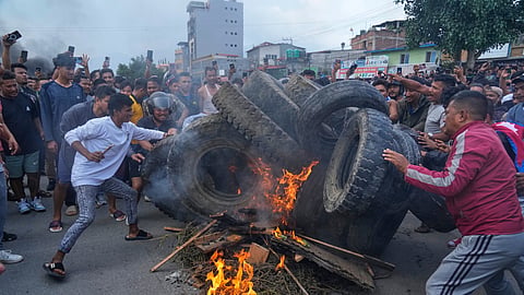 Protesters burn tires, violating the curfew orders in Kathmandu, Nepal, Tuesday, Sept. 9, 2025.