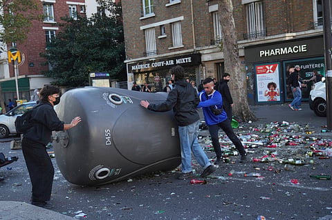Protesters block a street during the "Bloquons Tout" (Block Everything) protest movement in Paris, Wednesday, Sept. 10, 2025.