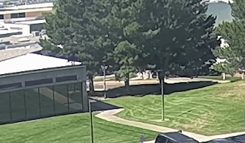 The CCTV footage showing Charlie Kirk's shooter jumping off the roof and feeling into the neighbourhood.