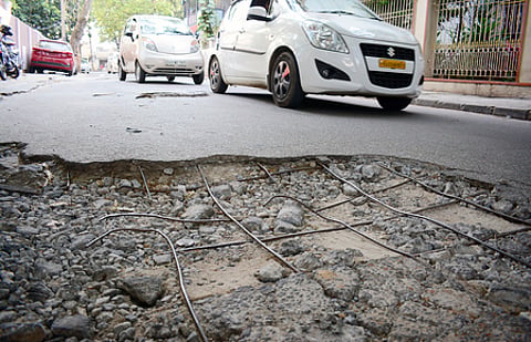 Huge potholes are seen on Coimbatore roads