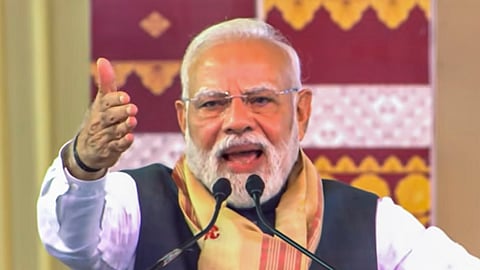 Prime Minister Narendra Modi addresses a gathering during laying of foundation stone and inauguration of developmental works, in Darrang, Assam.
