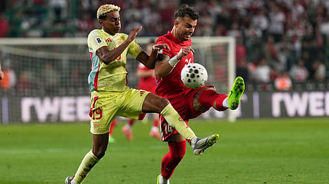 Spain's Lamine Yamal, left, and Turkey's Abdulkerim Bardakci fight for the ball during a World Cup qualifying round Group E soccer match between Turkey and Spain at Konya Buyuksehir stadium, in Konya, Turkey, Sunday, Sept. 7, 2025.