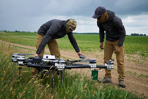 Engineers test a Ukrainian-made quadcopter drone at an undisclosed location in Ukraine, June 12, 2025.