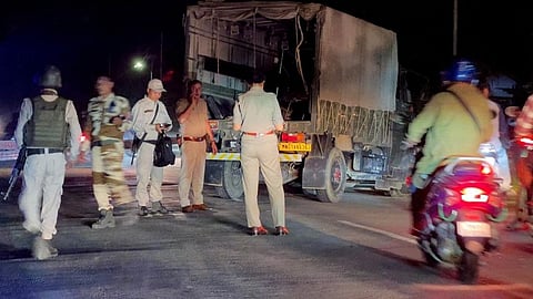 Police personnel around the vehicle that was attacked by armed men in Manipur’s Bishnupur district that killed two Assam Rifles jawans.