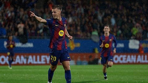 Barcelona's Dani Olmo celebrates his side's third goal during a Spanish La Liga soccer match between FC Barcelona and Getafe on Sunday, Sept. 21, 2025.