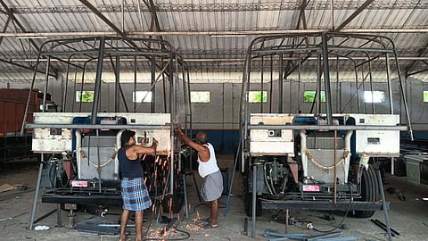 Lorries under construction at a lorry building unit in Namakkal