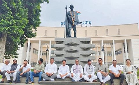 The Congress MLAs protested the decision of the Speaker and staged a dharna near the Mahatma Gandhi statue on the Assembly premises.