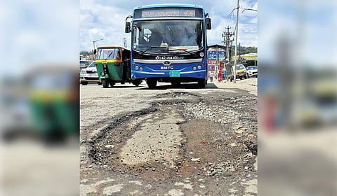It’s not the Moon! A large crater-size pothole in Bengaluru’s Magadi Road.