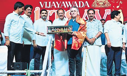 HRD and IT Minister Nara Lokesh and former Vice President Venkaiah Naidu at the inauguration of Vijayawada Utsav at Punnami Ghat in Vijayawada.