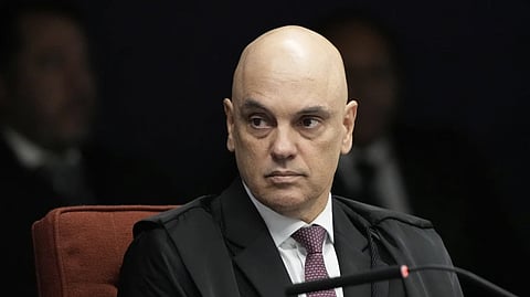 Supreme Court Justice Alexandre de Moraes attends the verdict and sentencing phase of a trial for those charged in an alleged coup plot to keep Brazil’s former President Jair Bolsonaro in office after his 2022 election defeat, in Brasilia, Brazil, Thursday, Sept. 11, 2025.