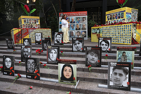 The faces of people activists say were killed by the government in Iran are displayed during a rally during the 80th session of the United Nations General Assembly, Tuesday, Sept. 23, 2025, in New York.