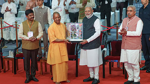 Prime Minister Narendra Modi being felicitated by Uttar Pradesh Chief Minister Yogi Adityanath during the inauguration of Uttar Pradesh International Trade Show 2025, in Greater Noida, Gautam Buddha Nagar district.