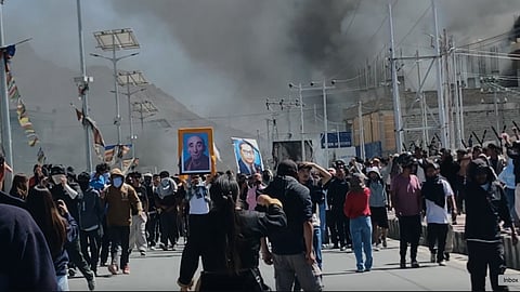 Smoke rises from buildings including the local office of India’s ruling Bharatiya Janata Party set ablaze during protests demanding greater autonomy from Indian government for the Himalayan territory in Leh town, Ladakh, India, Wednesday, Sept. 24, 2025.