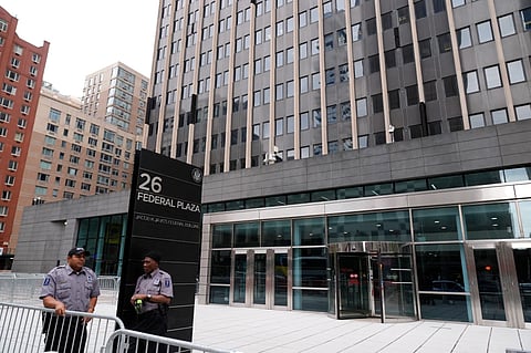 Security guards stand outside the Jacob K. Javits Federal Office Building at 26 Federal Plaza, Monday, Sept. 30, 2024, in New York.