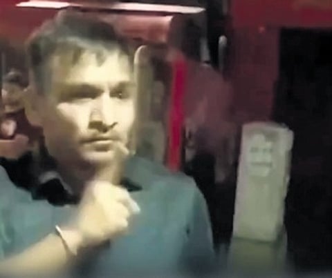 A screengrab showing the accused arguing with the police personnel