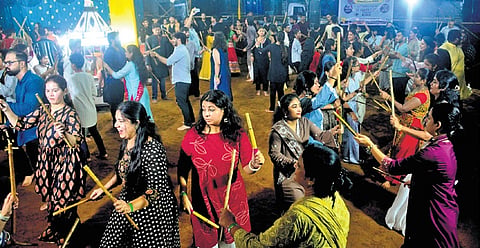 People of the Gujarati community performing dandiya at the pandal near College Square Gujarati School in Cuttack on Sunday.