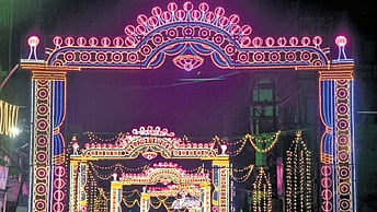 Decorative light gates dot the road at Mangalabag.