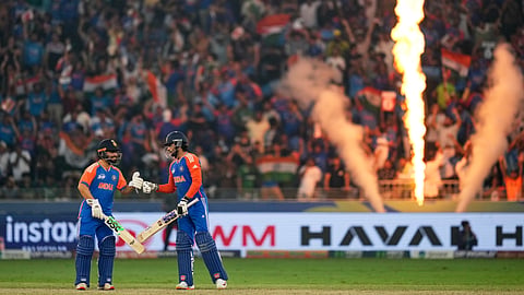 India's Rinku Singh, left, congratulates batting partner Tilak Varma after the latter hit a six during the Asia Cup cricket final between India and Pakistan at Dubai International Cricket Stadium, United Arab Emirates, Sunday, Sept. 28, 2025.