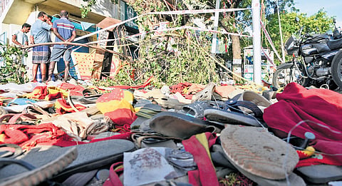 Party flag and chappels remain after the rampage at TVK leader campaign rally in Karur on Sunday: