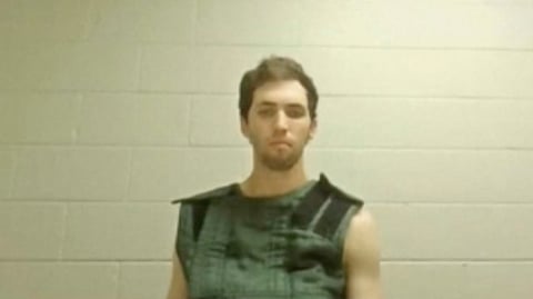 In this image from a video provided by Utah State Courts, Tyler James Robinson attends a virtual court hearing from prison in Utah