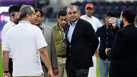 Pakistan's Minister of Interior and President of the Asian Cricket Council Mohsin Naqvi, center, stands with officials on the field after India won the Asia Cup cricket final against Pakistan on Sunday, Sept. 28, 2025.