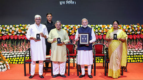 Prime Minister Narendra Modi along with ,Union Minister of Culture and Tourism Gajendra Singh Shekhawat, BJP leader Vinay Sahasrabuddhes and Delhi Chief Minister Rekha Gupta during the centenary celebrations of the Rashtriya Swayamsevak Sangh (RSS), in New Delhi on Wednesday.